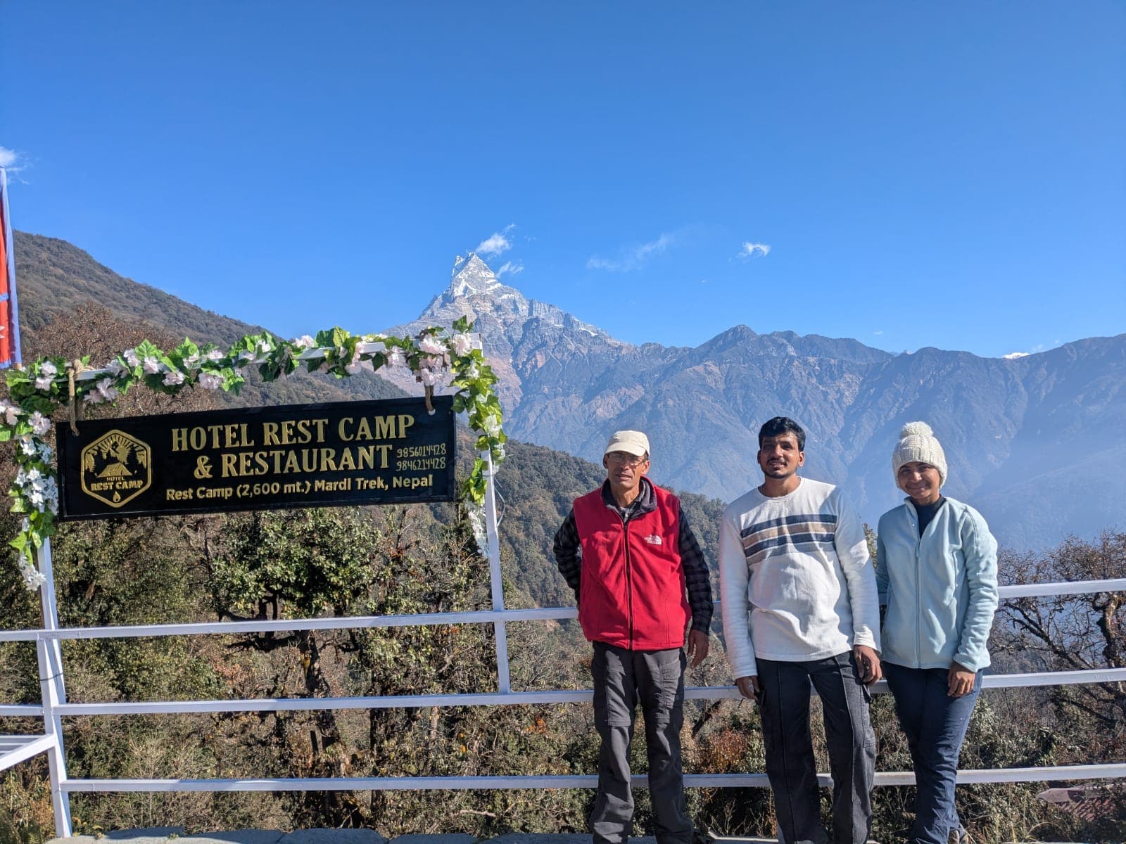 Mardi Trek hikers at Rest Camp with Machapuchare mountain, Nepal