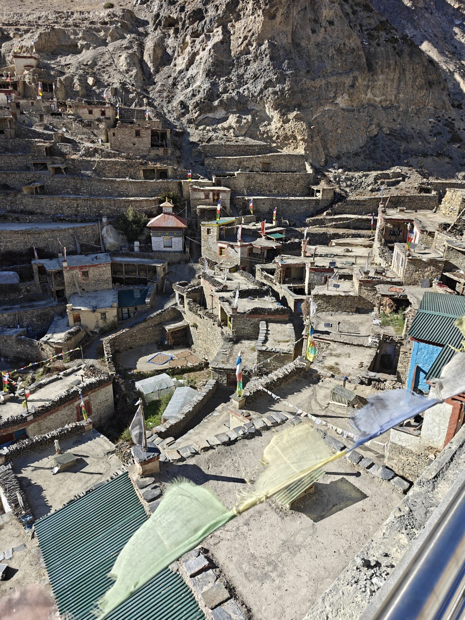 Terraced stone village on a rocky cliff in Nepal