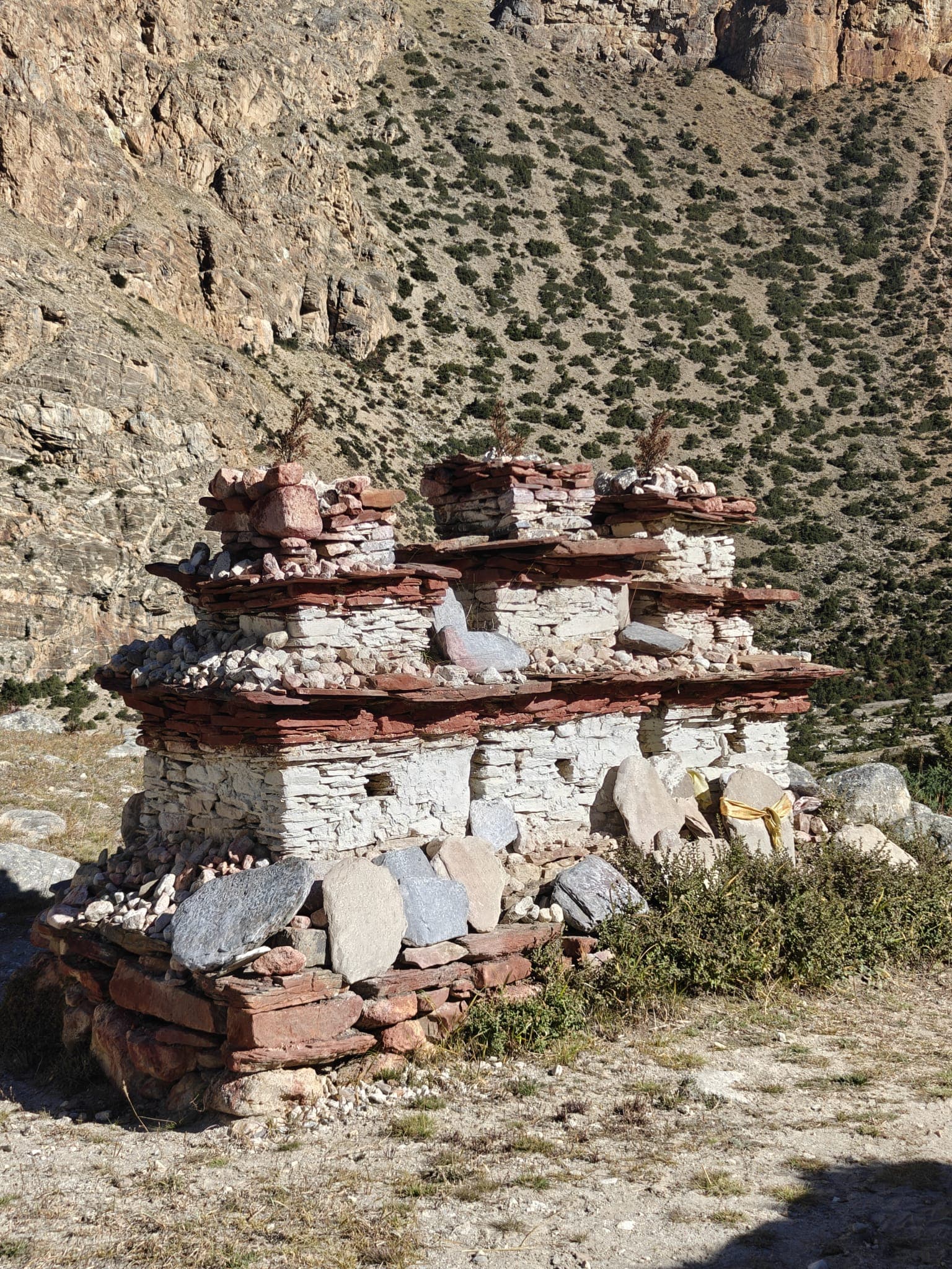 Traditional stone chorten in rugged Himalayan landscape